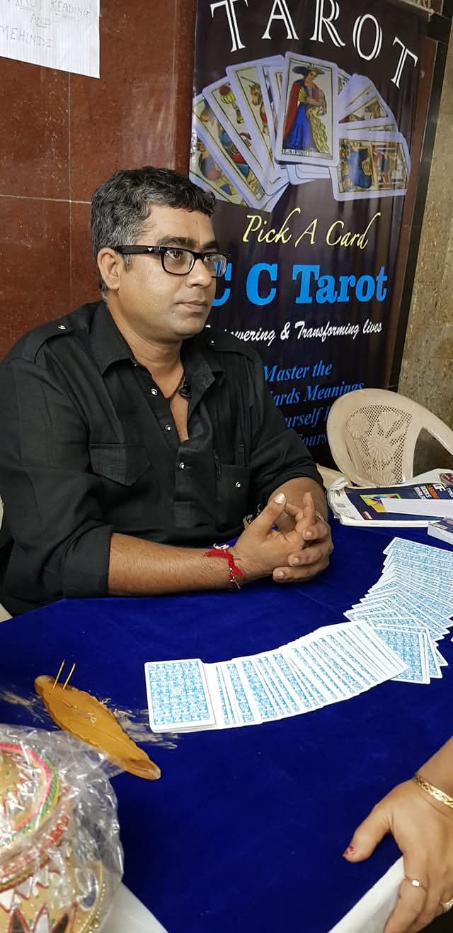 Aacharya Chintan Anand Chande at a C C Tarot reading session with Tarot cards